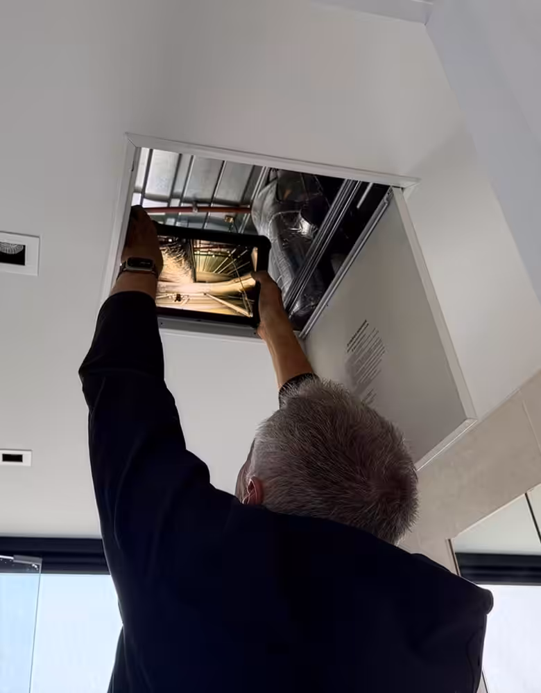 New home construction stage inspection checking structural framing compliance.